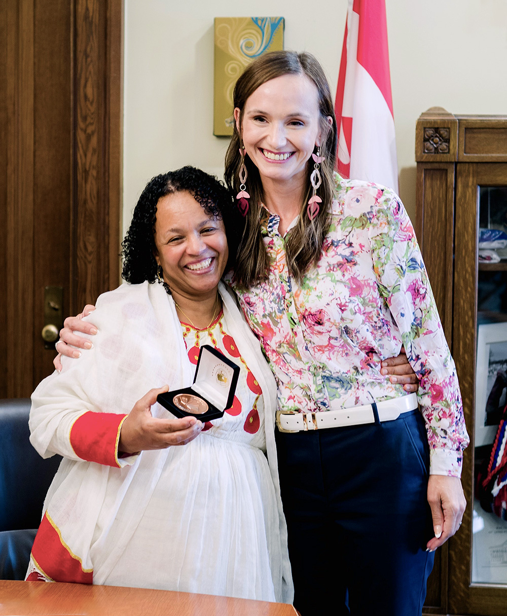 Photo of Ayni Ahmed, Manitoba Recipient of the 2024 COF Literacy Award; and Manitoba Advanced Education and Training Minister Renée Cable